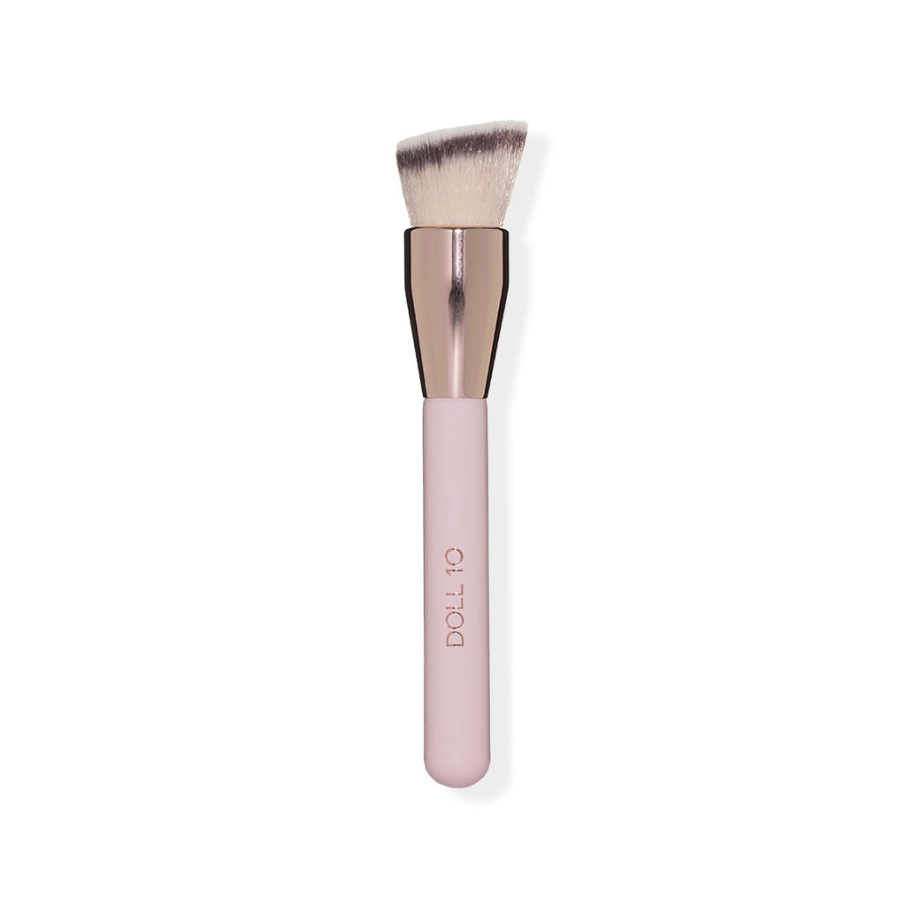 angled brush head for buffing foundation with pink handle and rose gold accents
