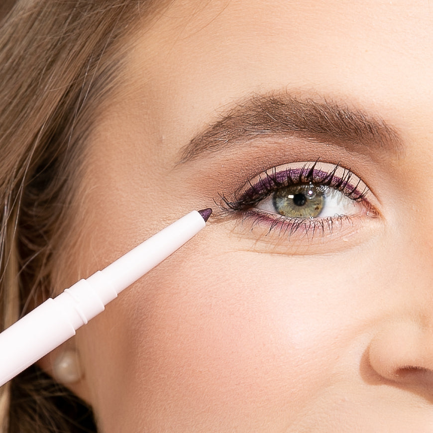 eye model showing where to place the eyeliner on the top lid above the eyelash line and below the bottom lashes if preferred as well