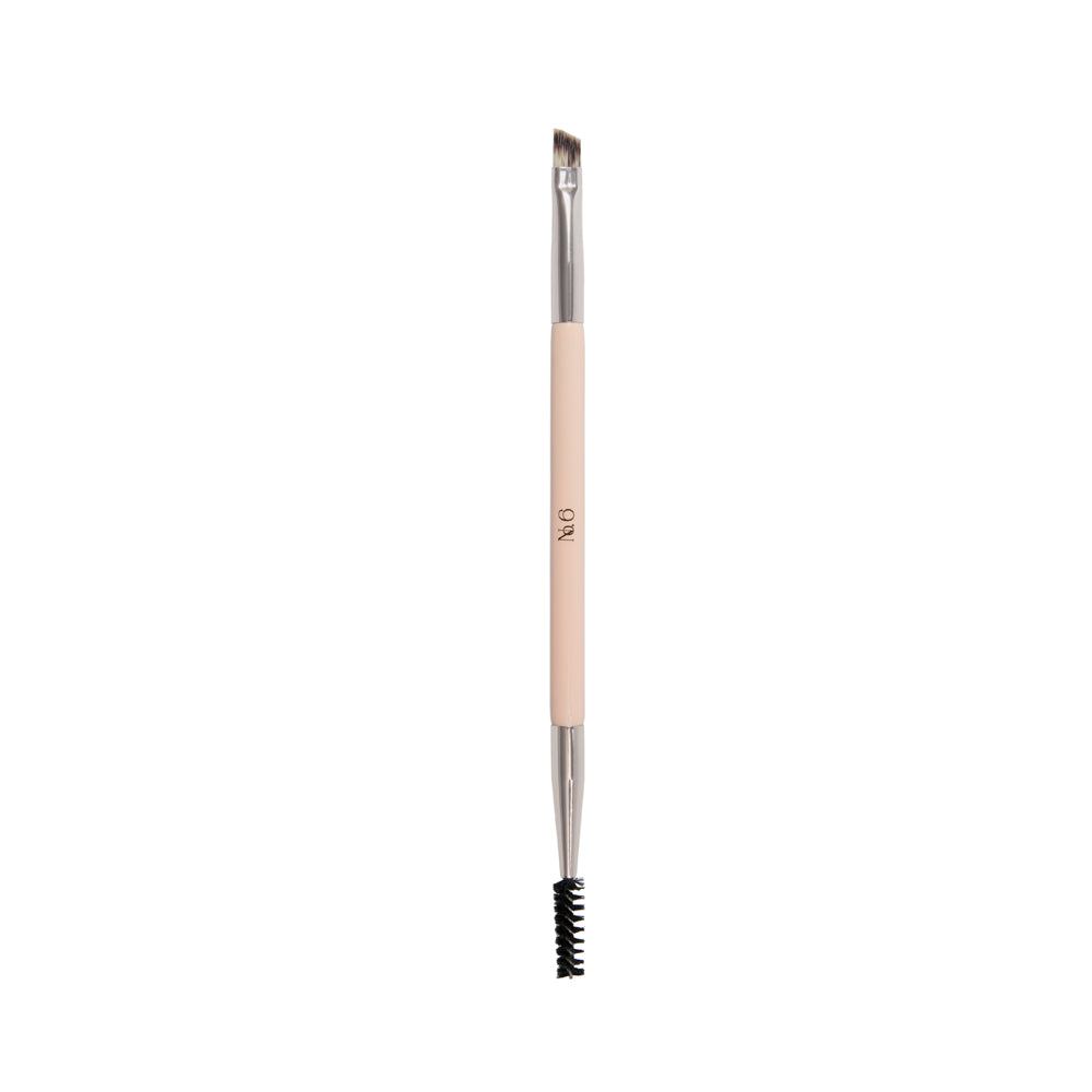 beige handle brush with silver accents. double ended brush - one end featuring a brow sculpting angled brush, the other end features a brow brush to straighten brow hairs after gel application. 