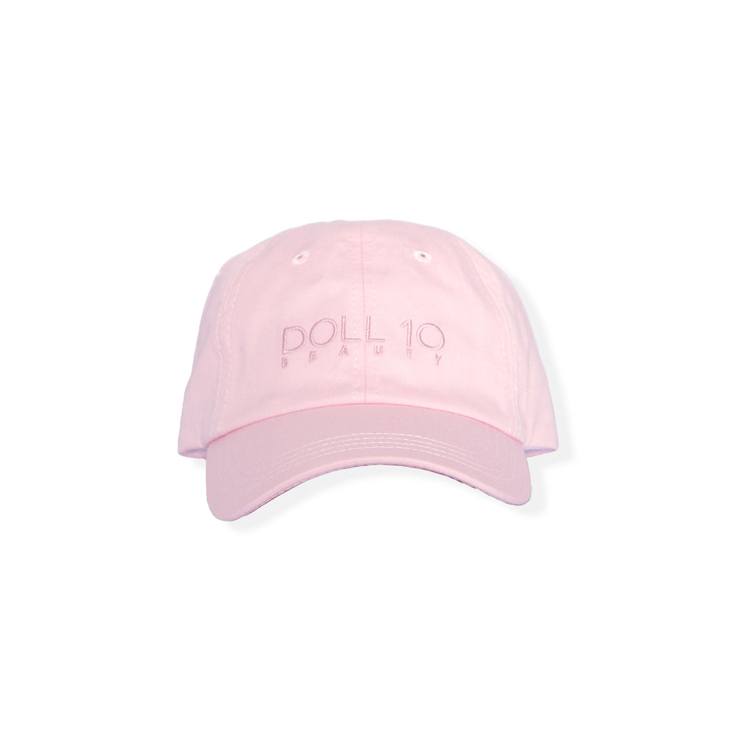 light pink baseball hat with doll10 logo stitched on the front