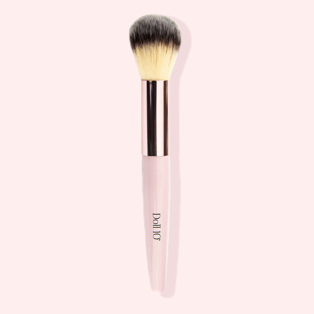 contouring brush with pink handle and rose gold accents